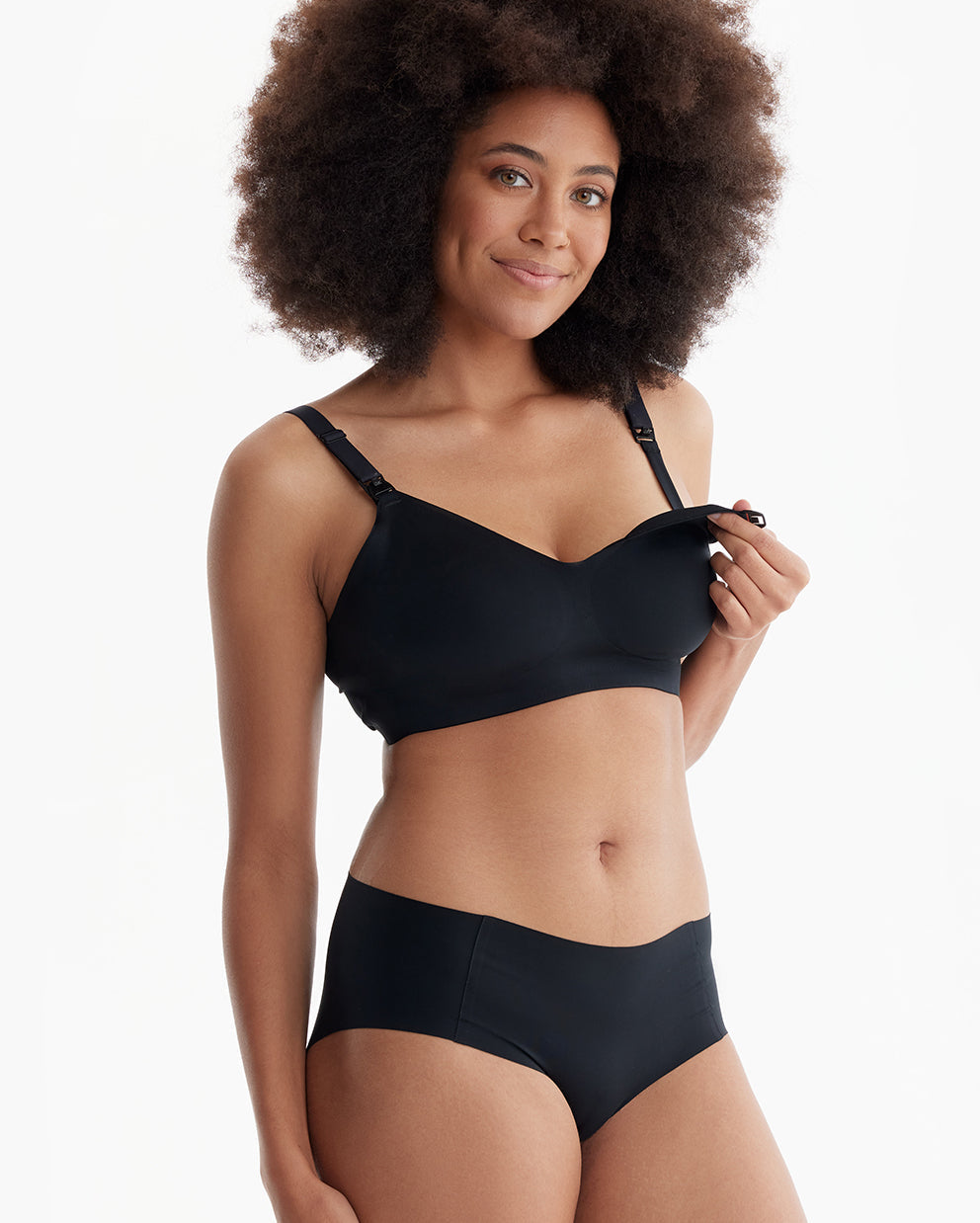 Smiling model in black Ultra Soft Seamless Nursing Bra YN21, showcasing its easy one-hand clip & comfortable design.